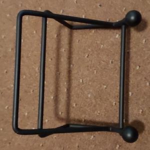 Black iron easel book or heavy art stand.